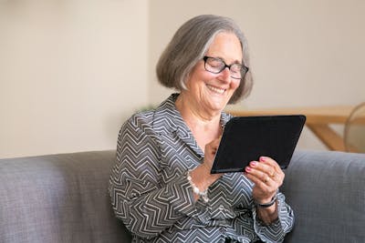 Image of a lonely senior connecting online