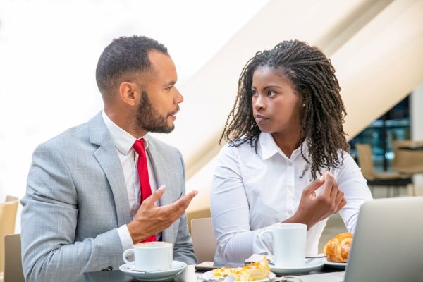 Couple having an argument while one relies on AI emotional support for defense